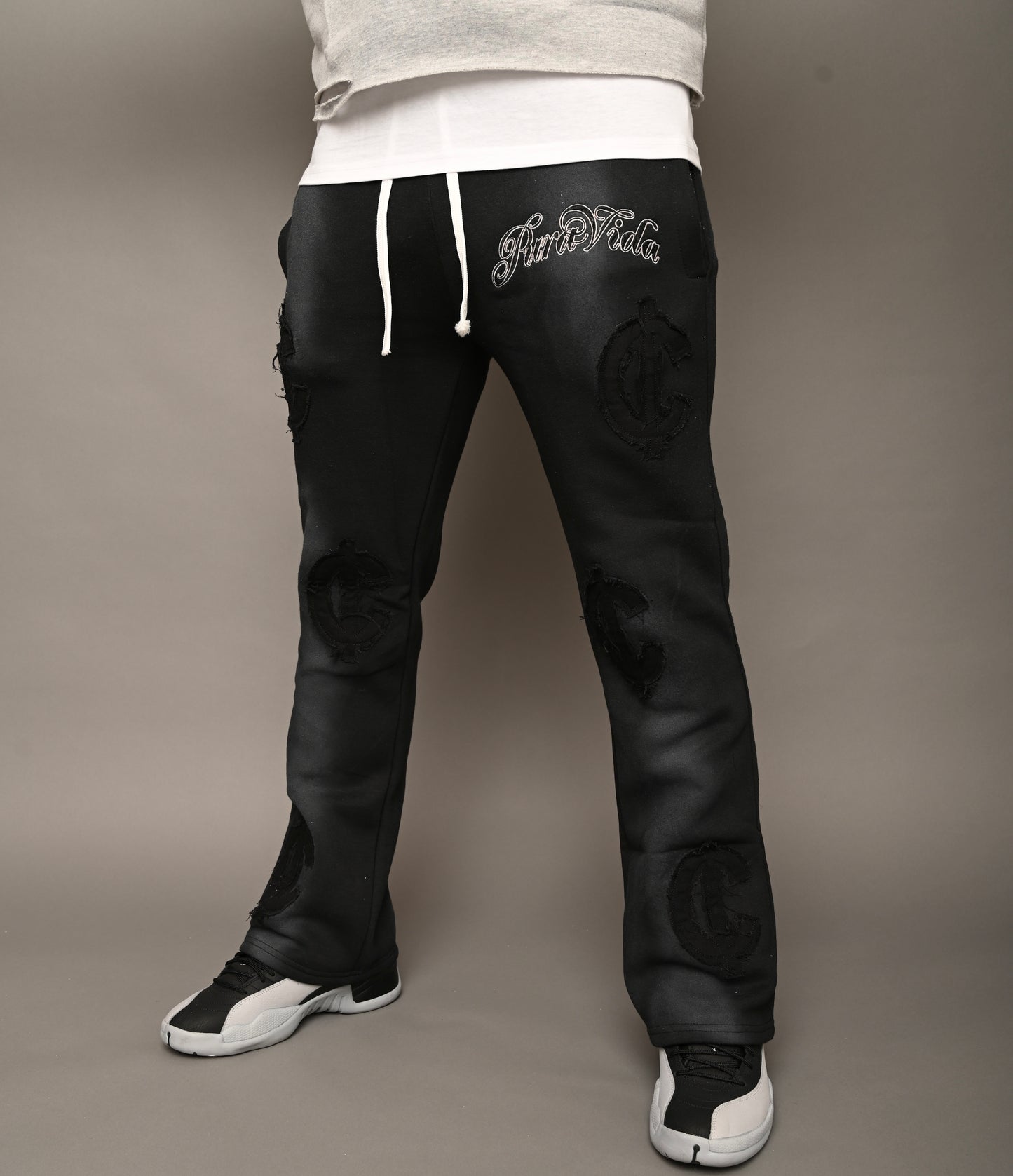 “Cent Logo Distressed Pants”